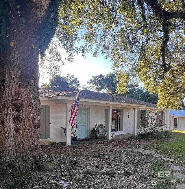 single story home featuring covered porch