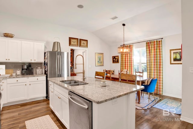 kitchen with sink, white cabinetry, stainless steel appliances, lofted ceiling, and a center island with sink