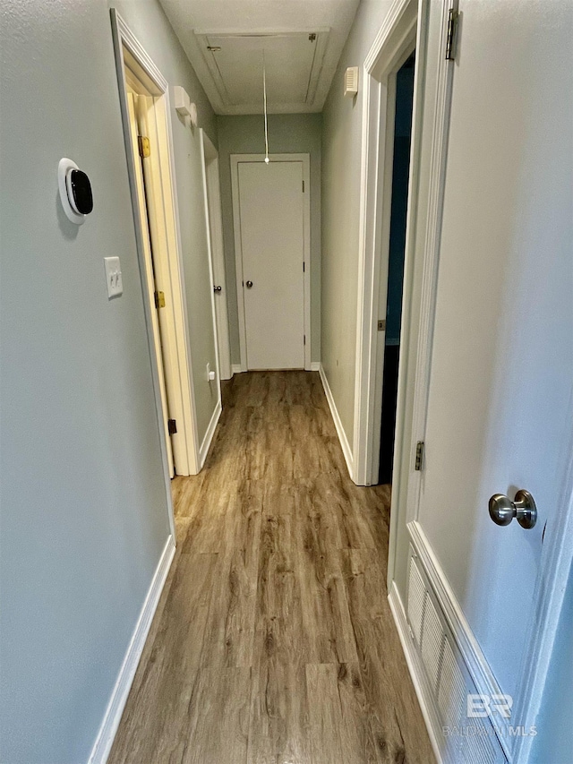 hallway with light wood-type flooring