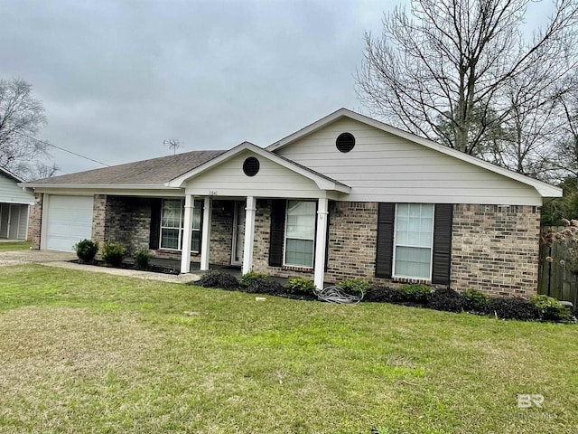 single story home featuring a garage and a front yard