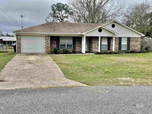 ranch-style house featuring a garage and a front lawn