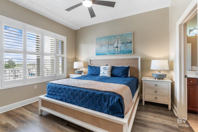bedroom featuring dark wood-type flooring, baseboards, and a ceiling fan
