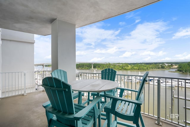 balcony featuring a water view