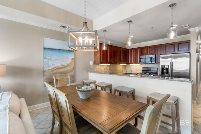 dining space featuring ornamental molding, visible vents, and light tile patterned flooring