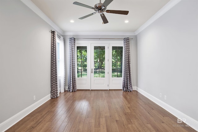 spare room featuring ceiling fan, hardwood / wood-style floors, and ornamental molding