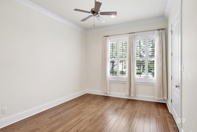 unfurnished room with light hardwood / wood-style floors, ceiling fan, and crown molding