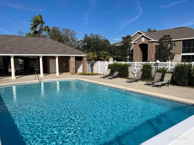 view of swimming pool with a patio area