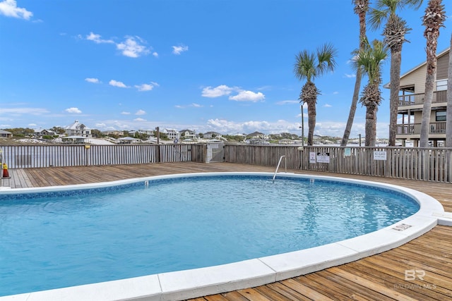 pool featuring a deck and a residential view
