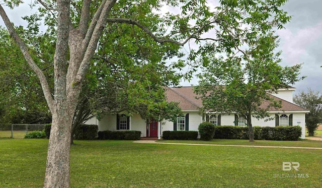 view of front of property with fence and a front yard