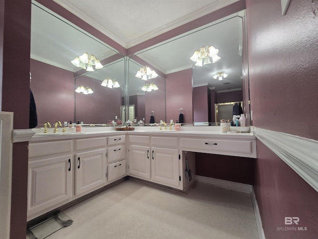 bathroom with double vanity, a chandelier, crown molding, and a sink