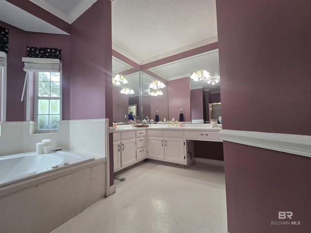 bathroom with a chandelier, ornamental molding, a garden tub, and double vanity