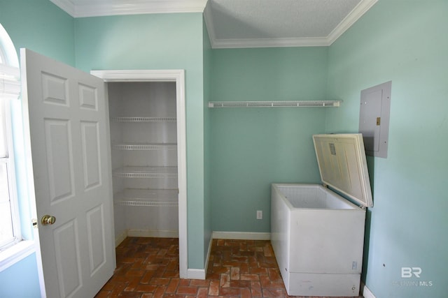 11151 Colvin Ln, Daphne, AL 36526 - laundry area with electric panel, ornamental molding, brick flooring, and baseboards