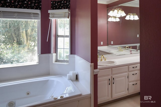 11151 Colvin Ln, Daphne, AL 36526 - bathroom with vanity, a jetted tub, and a chandelier