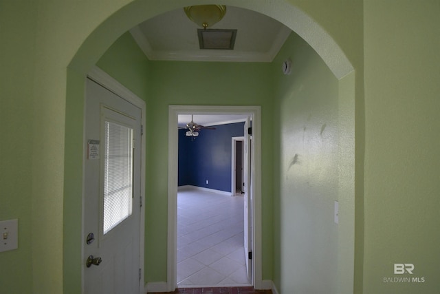 11151 Colvin Ln, Daphne, AL 36526 - hallway featuring baseboards, crown molding, tile patterned flooring, and arched walkways