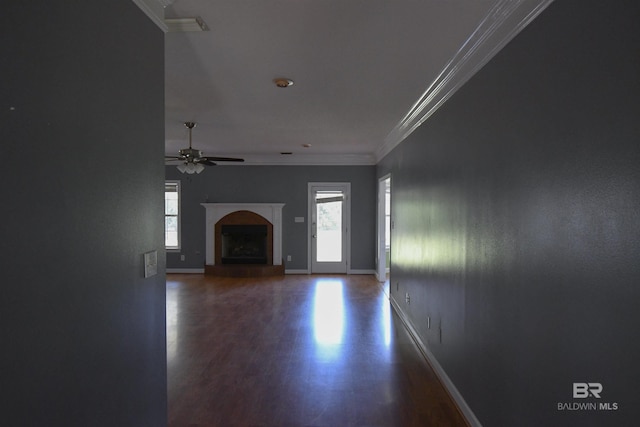 11151 Colvin Ln, Daphne, AL 36526 - unfurnished living room with wood finished floors, ornamental molding, ceiling fan, baseboards, and a fireplace with raised hearth
