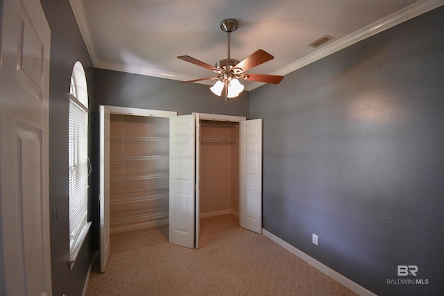 11151 Colvin Ln, Daphne, AL 36526 - unfurnished bedroom with ornamental molding, multiple closets, light colored carpet, baseboards, and ceiling fan