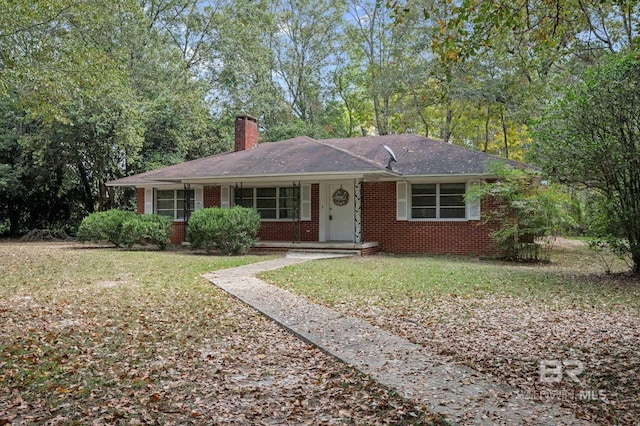 single story home featuring a front yard