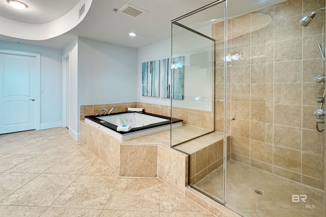 bathroom with a bath, visible vents, a shower stall, and tile patterned floors