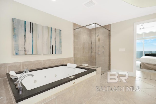 ensuite bathroom featuring ensuite bath, tile patterned floors, a whirlpool tub, and a shower stall