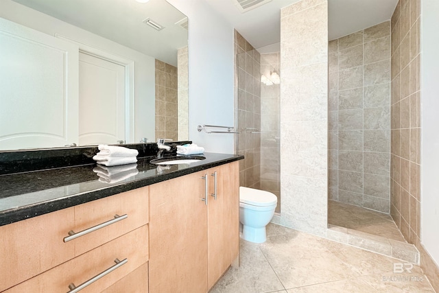 full bath featuring tile patterned floors, visible vents, toilet, walk in shower, and vanity