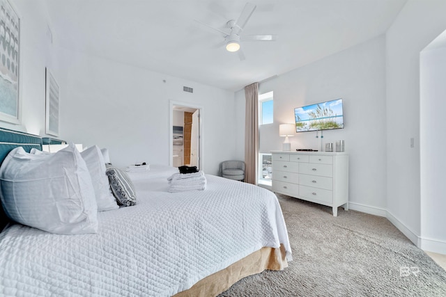 bedroom featuring visible vents, baseboards, carpet floors, and ceiling fan