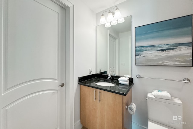 half bath with toilet and vanity