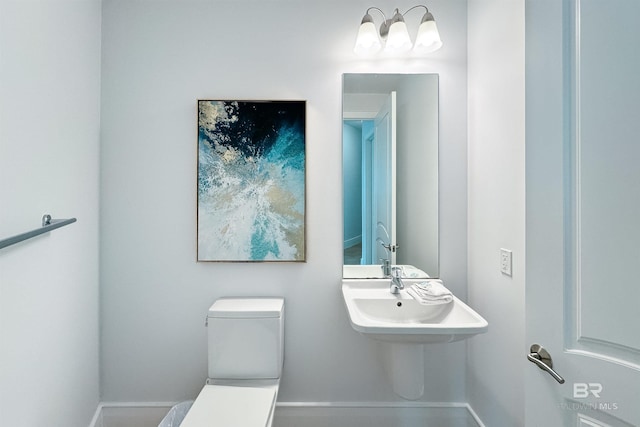 bathroom featuring a sink and toilet