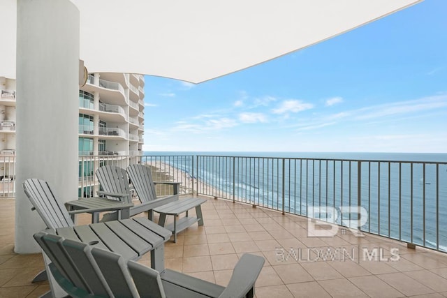 balcony featuring a water view