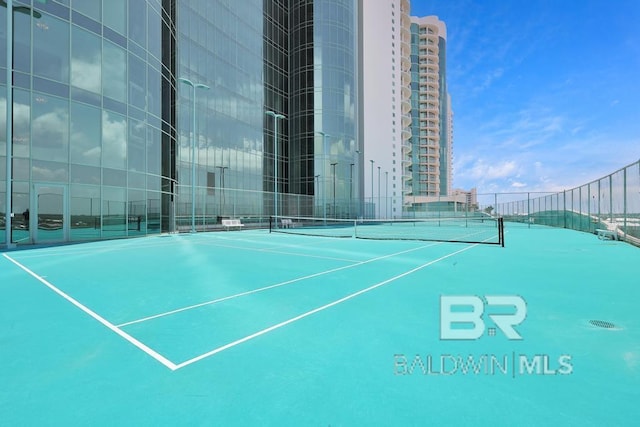 view of sport court with fence