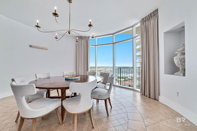 dining area with a wall of windows, baseboards, a chandelier, and light tile patterned floors