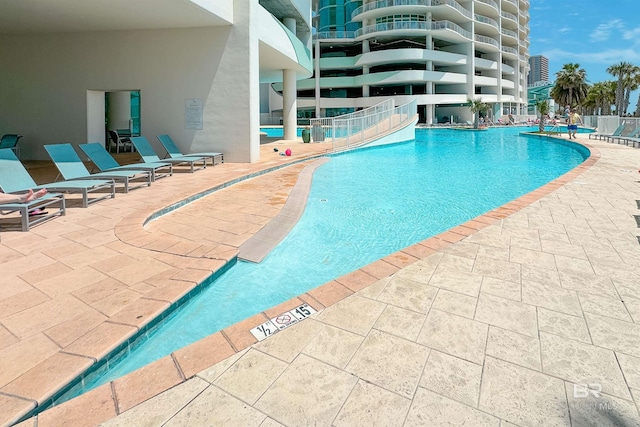 pool featuring a patio area