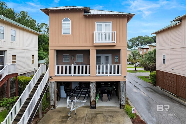 back of house with a carport