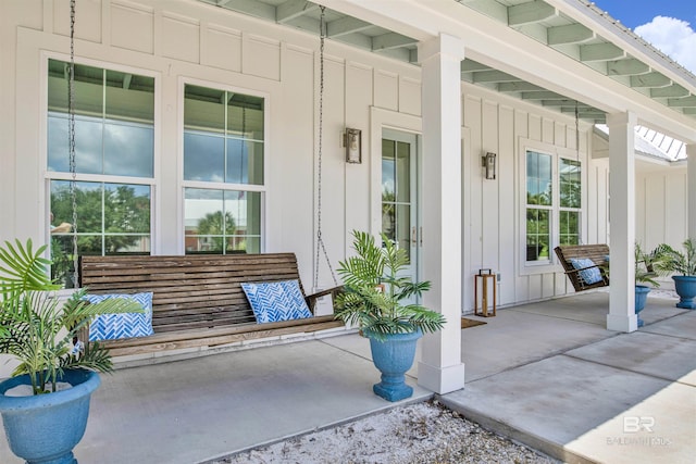 view of exterior entry featuring a porch