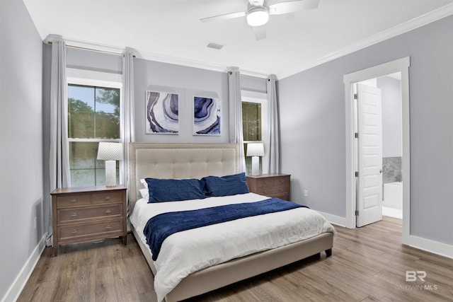 bedroom with connected bathroom, ceiling fan, crown molding, and light hardwood / wood-style floors