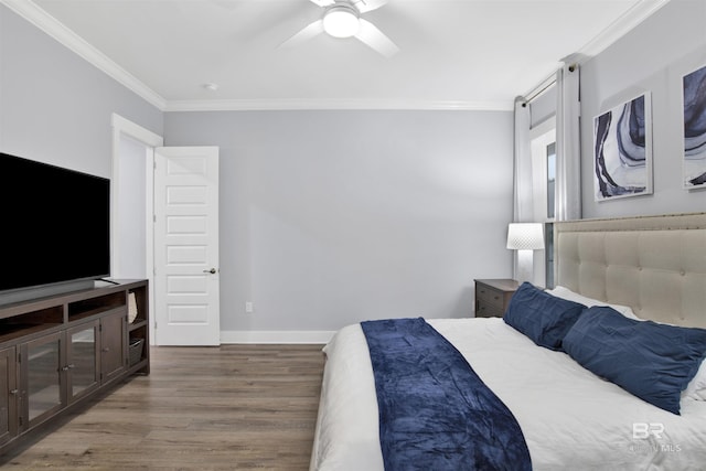 bedroom featuring hardwood / wood-style floors, ceiling fan, and ornamental molding