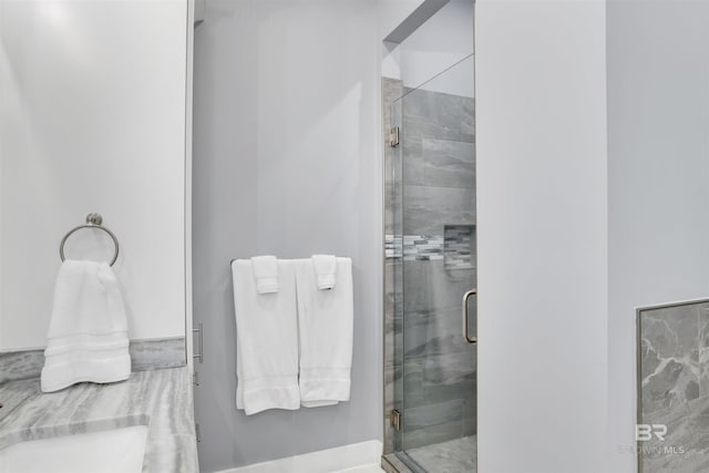 bathroom with a shower with shower door