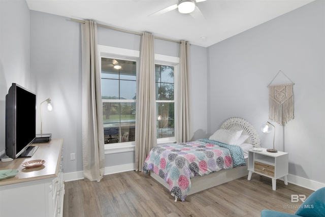 bedroom featuring ceiling fan and light hardwood / wood-style flooring