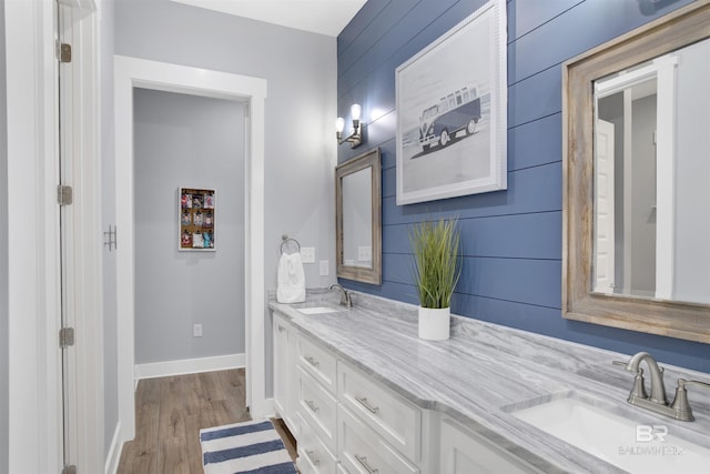 bathroom featuring vanity and hardwood / wood-style flooring