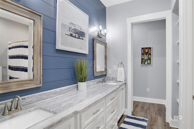 bathroom with vanity and hardwood / wood-style flooring