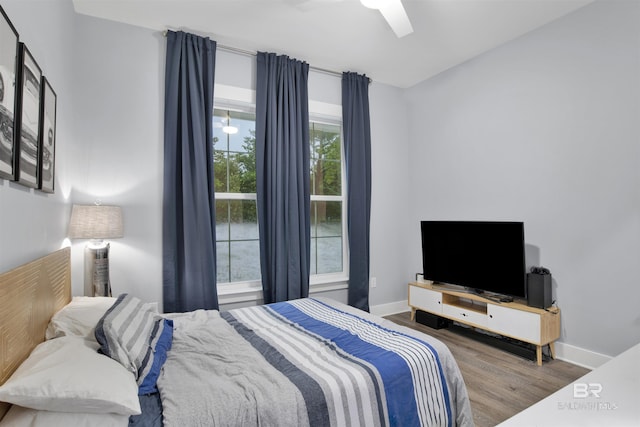 bedroom with hardwood / wood-style flooring and ceiling fan