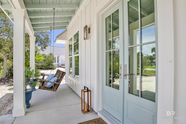 view of patio / terrace featuring covered porch and french doors