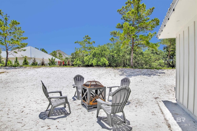 view of patio / terrace featuring an outdoor fire pit