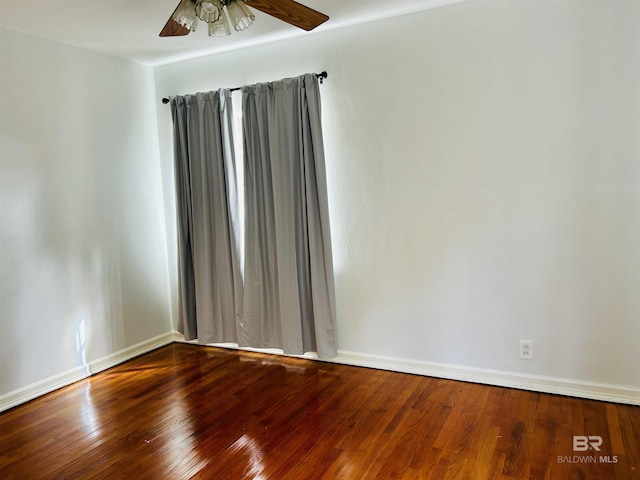 unfurnished room with ceiling fan and wood-type flooring