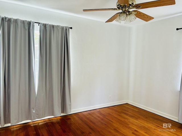 unfurnished room with hardwood / wood-style flooring and ceiling fan