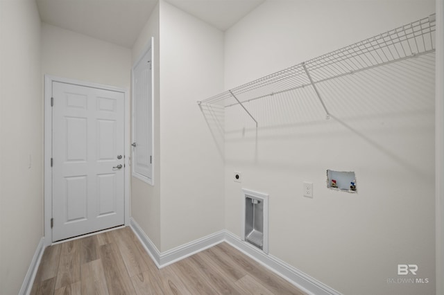 laundry room with laundry area, light wood finished floors, baseboards, washer hookup, and electric dryer hookup
