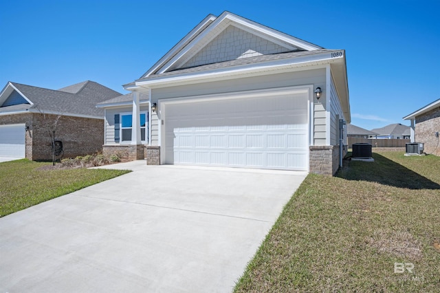 view of front facade with central air condition unit, a garage, a front lawn, and concrete driveway