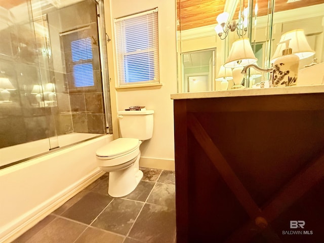 full bath with vanity, toilet, baseboards, and enclosed tub / shower combo