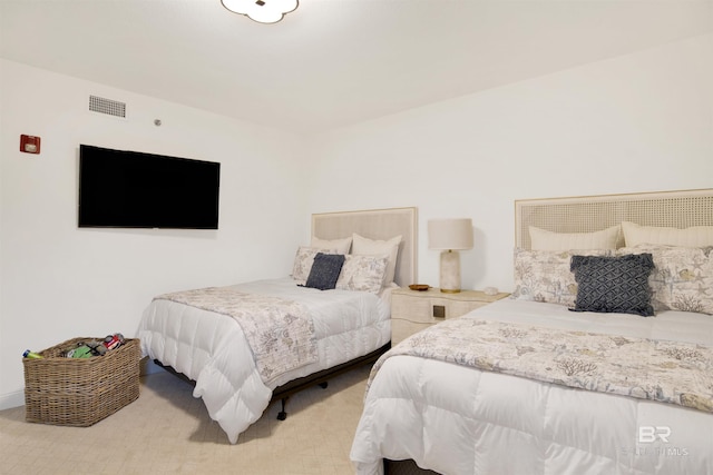 bedroom featuring visible vents and carpet flooring