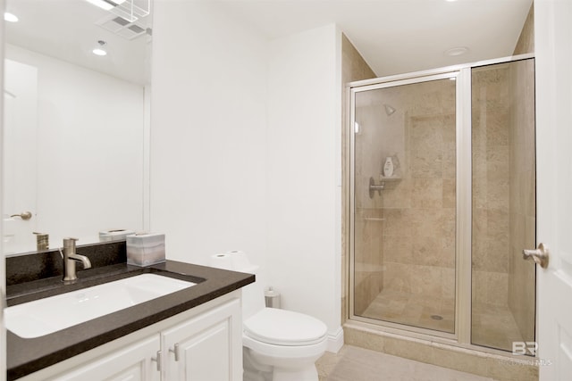 full bathroom with a stall shower, toilet, and vanity