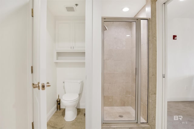 full bath with tile patterned flooring, toilet, baseboards, and a stall shower